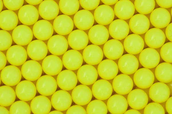 Yellow plastic ball background — Stock Photo, Image