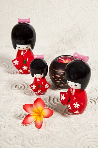 Trhee Japanese dolls on paper background — Stock Photo, Image