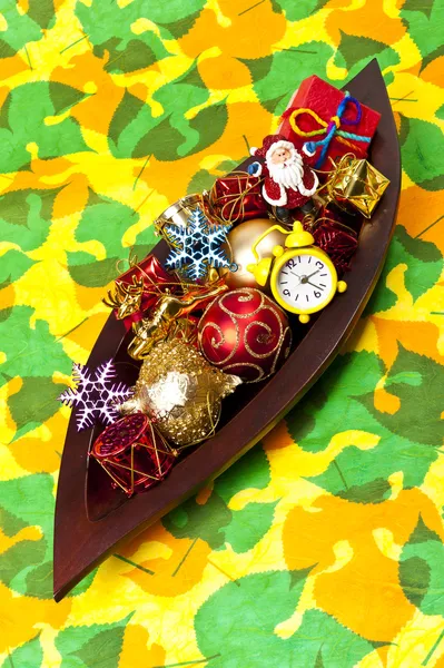 Christmas gifs and decoration in the wooden leaf tray — Stock Photo, Image