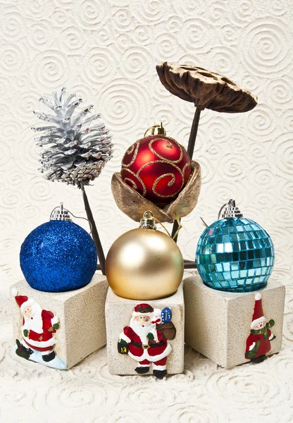 Four Christmas balls with nelumbo lotus and pine cone — Stock Photo, Image