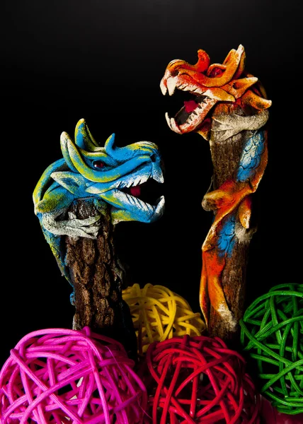 Two dragons climbing on tree isoloated on black background — Stock Photo, Image
