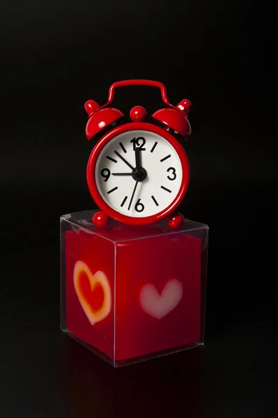 Lovely Red Clock Top Red Candle Isolated Black Background — Stockfoto