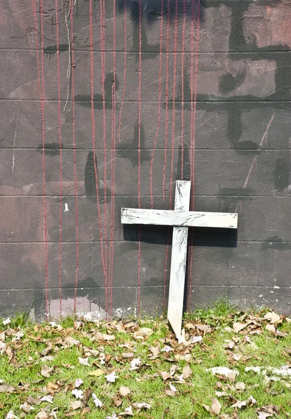 Wooden cross lean on the wall — Stok fotoğraf