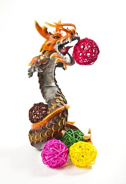 Orange dragon with colorful weave balls — Stok fotoğraf