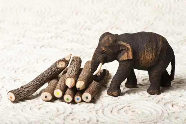 Wooden elephant with wooden color pencil — Stock Photo, Image