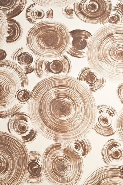 Duvar arka plan üzerinde kahverengi spiral — Stok fotoğraf