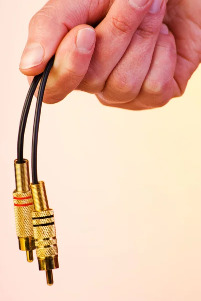 Connettori audio in mano — Foto Stock