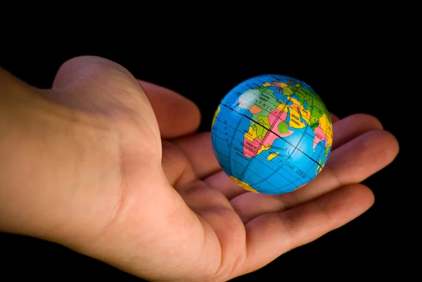 stock image Globe hanging above the palm