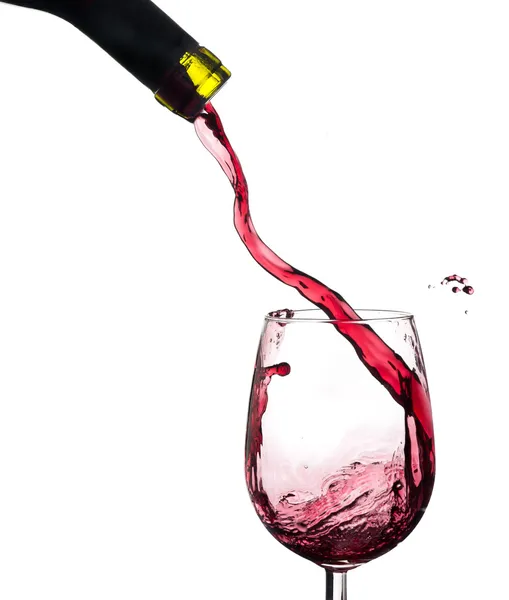 Wijn splash op een glas, witte achtergrond. — Stockfoto
