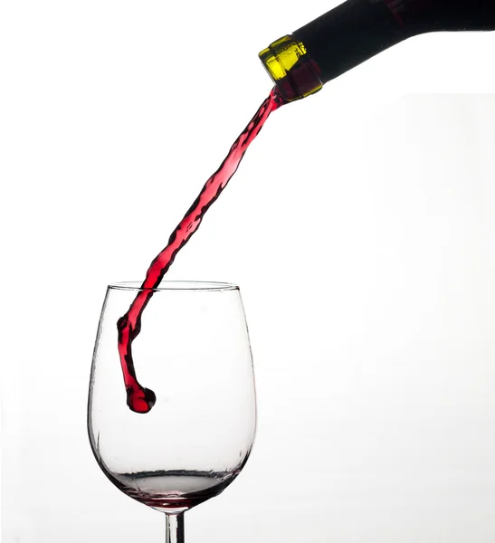 Víno splash na sklo. — Stock fotografie