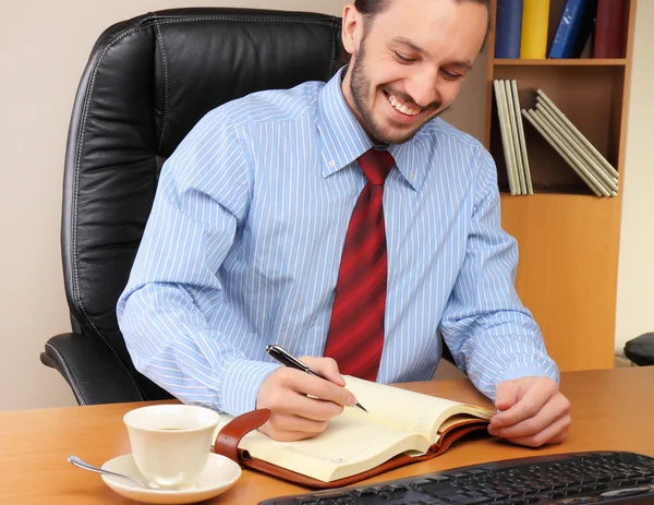 Businessman at office working at his workplace. — Stock Photo, Image