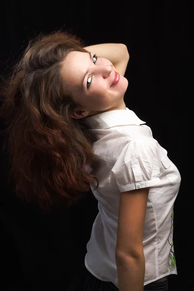 Girl dishevelled hair isolated black background — Stock Photo, Image