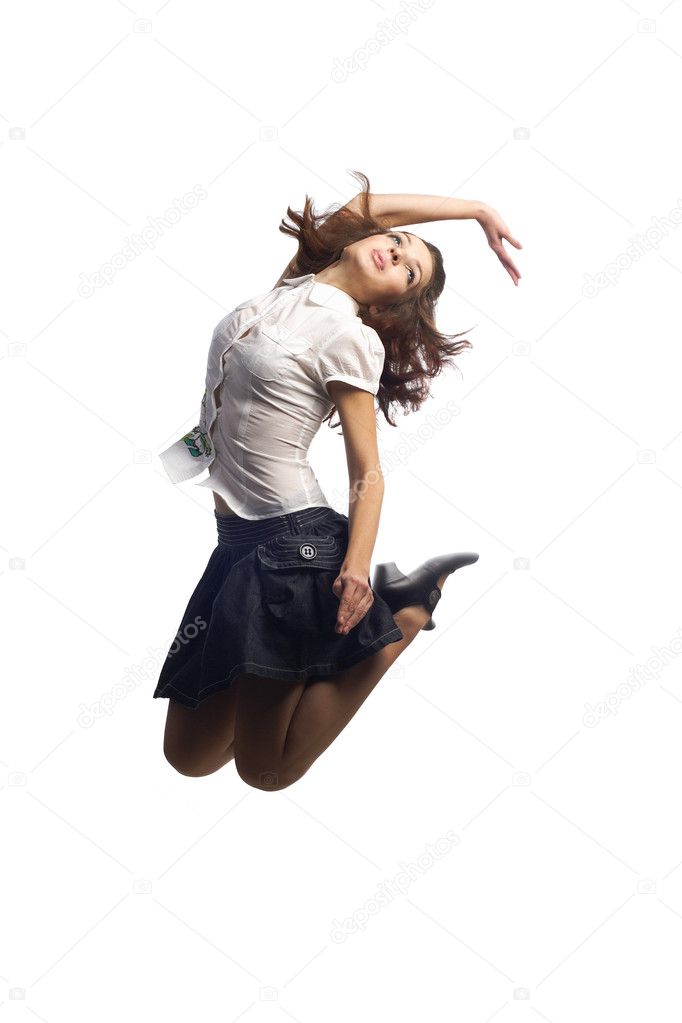 Girl in skirt jumping isolated white
