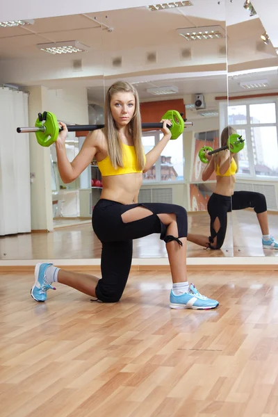 Beautiful girl with weight gym indoors — Stock Photo, Image