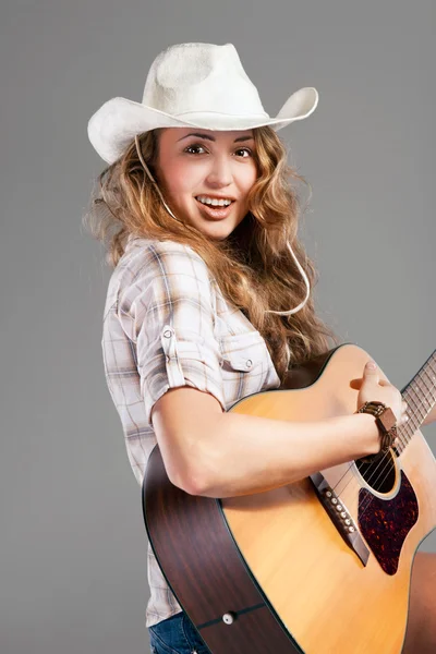 stock image Sesy cowgirl in cowboy hat with acoustic guitar