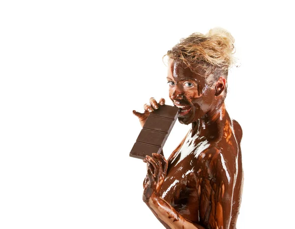 Naked blond girl eating chocolate — Stock Photo, Image