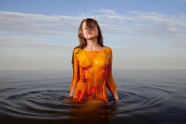 stock image Girl posing in the Water at sunset