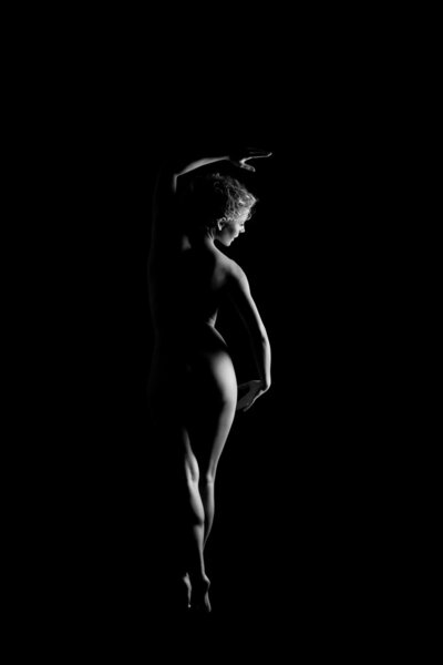 Young background naked women on black background