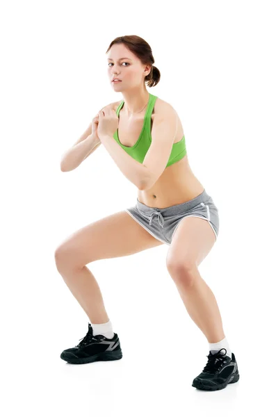 Mujer joven haciendo gimnasia — Foto de Stock