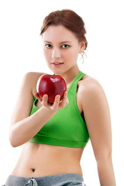 Donna in abbigliamento sportivo con mela — Foto Stock