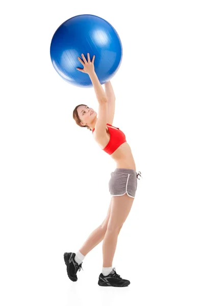 Kvinna utövar på en övning boll — Stockfoto