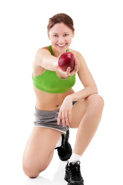 Mulher em sportswear com maçã — Fotografia de Stock