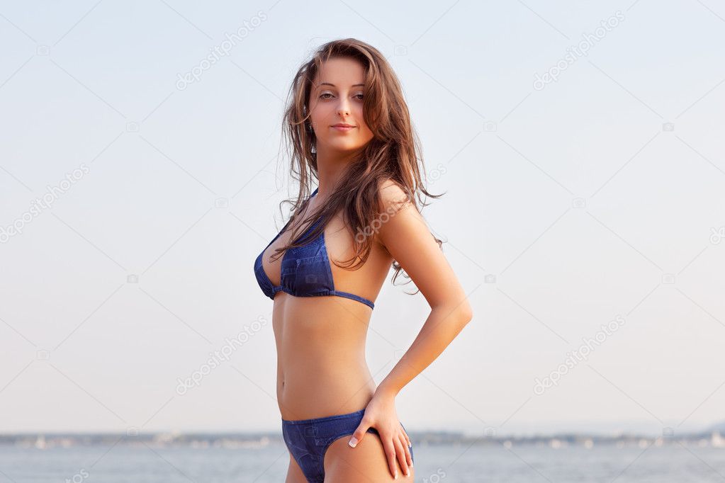 Beautiful young woman on water background Stock Photo by