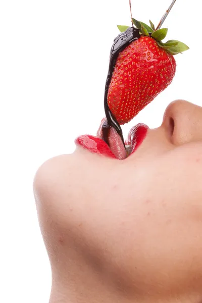 Girl eating strawberry with chocolate sauc — Stock Photo, Image