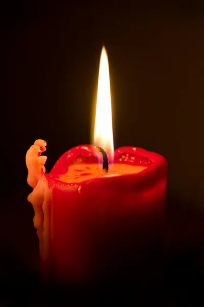 Красная свеча с пламенем Стоковое Изображение