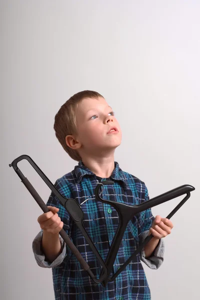 Stock image Boy with coat-hanger