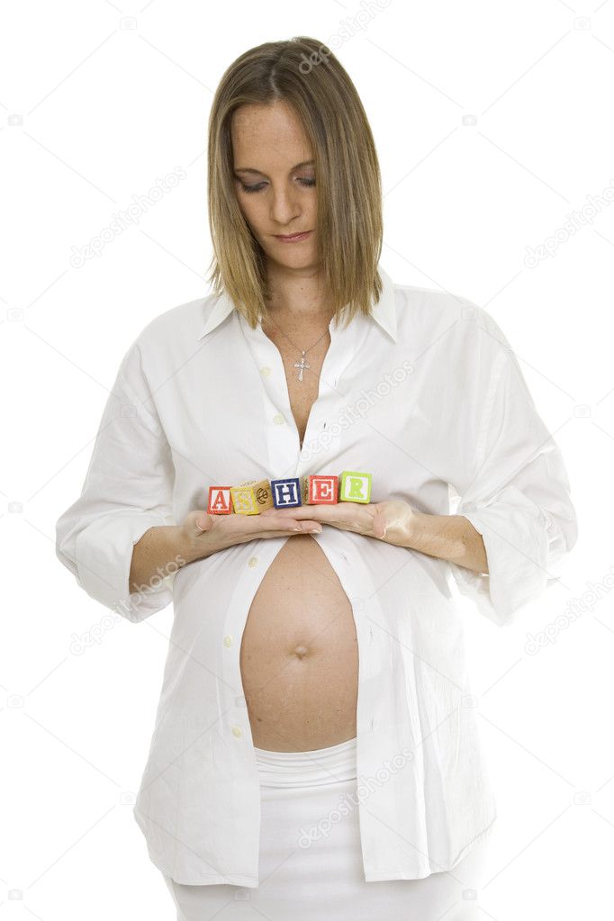 Beautiful Pregnant Woman Holding Baby Blocks