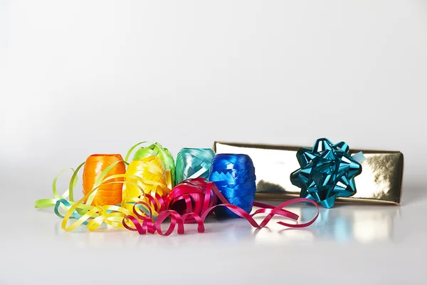 stock image Set of colourful ribbons and a christmas gift