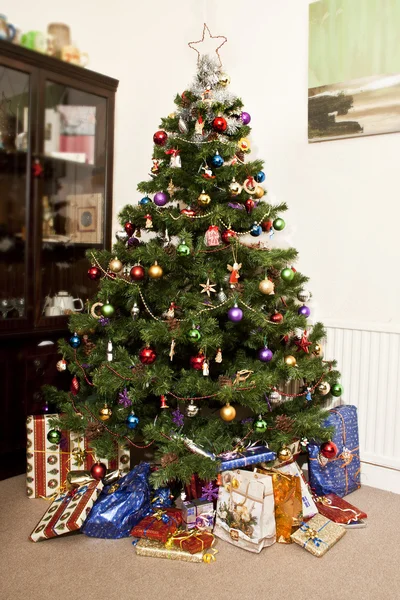 stock image Traditional polish christmas tree and gifts wrapped in colorful papers