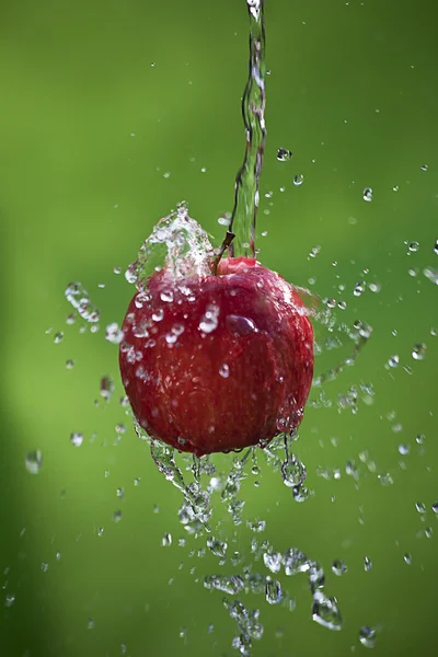 Apple with a splash — Stock Photo, Image