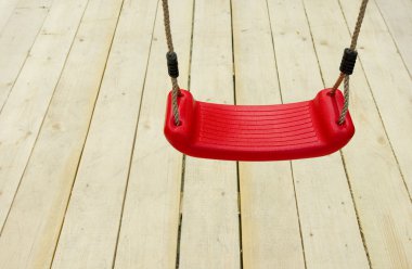 Red children's swing clipart