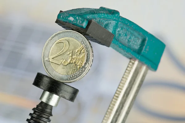 Eurocoin in a clamp — Stock Photo, Image