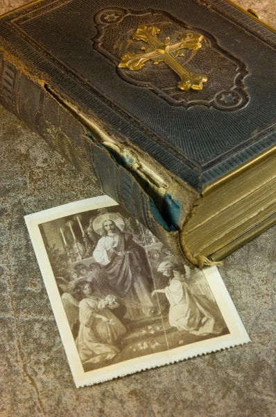 stock image Old bible with picture of saints