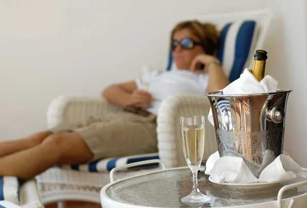 Relaxing woman with champagner bucket — Stock Photo, Image