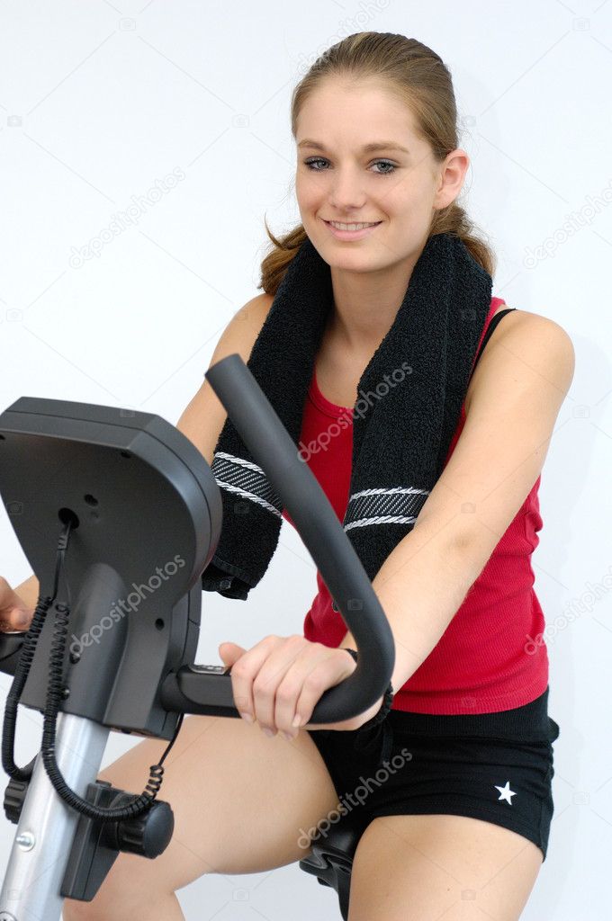 Young sporty on a training bike