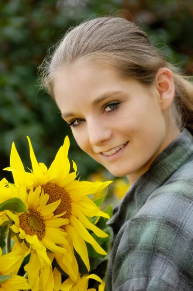 stock image Girl with sunflowers