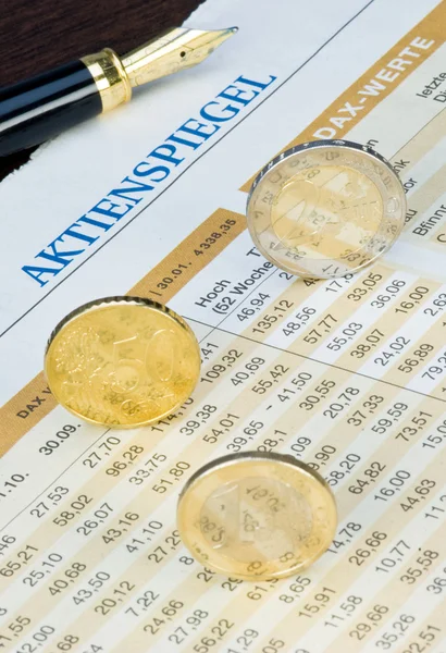 Euro coins on a finance chart — Stock fotografie