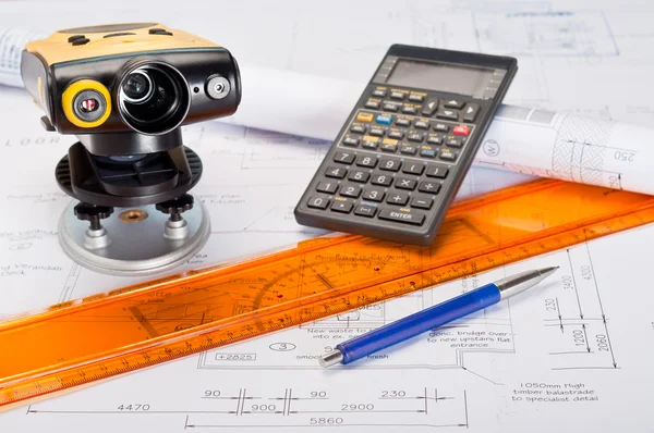 stock image Building plans with laser distance measurement device and calculator