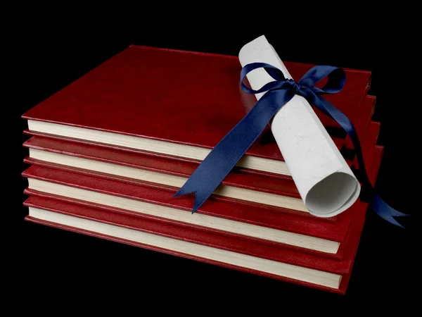 Diploma over books — Stock Photo, Image
