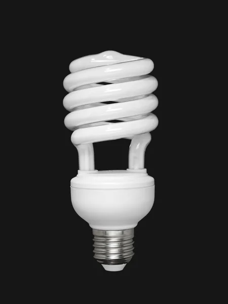 Fluorescent light bulb over black — Stock Photo, Image