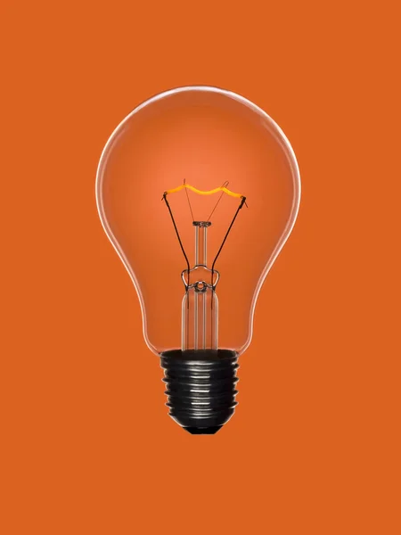 Ampoule allumée orange — Photo