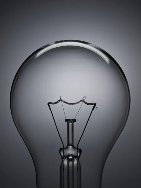 Bulb light over gray — Stock Photo, Image