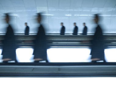 Blurred businessmen go to work clipart