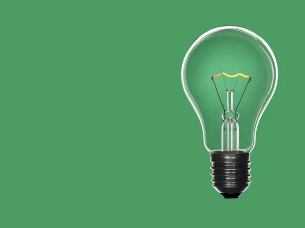Bulb light over green — Stock Photo, Image