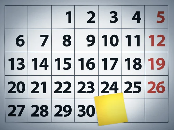 Nota pegajosa em branco em um calendário — Fotografia de Stock