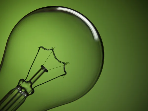 Bulb light over green — Stock Photo, Image